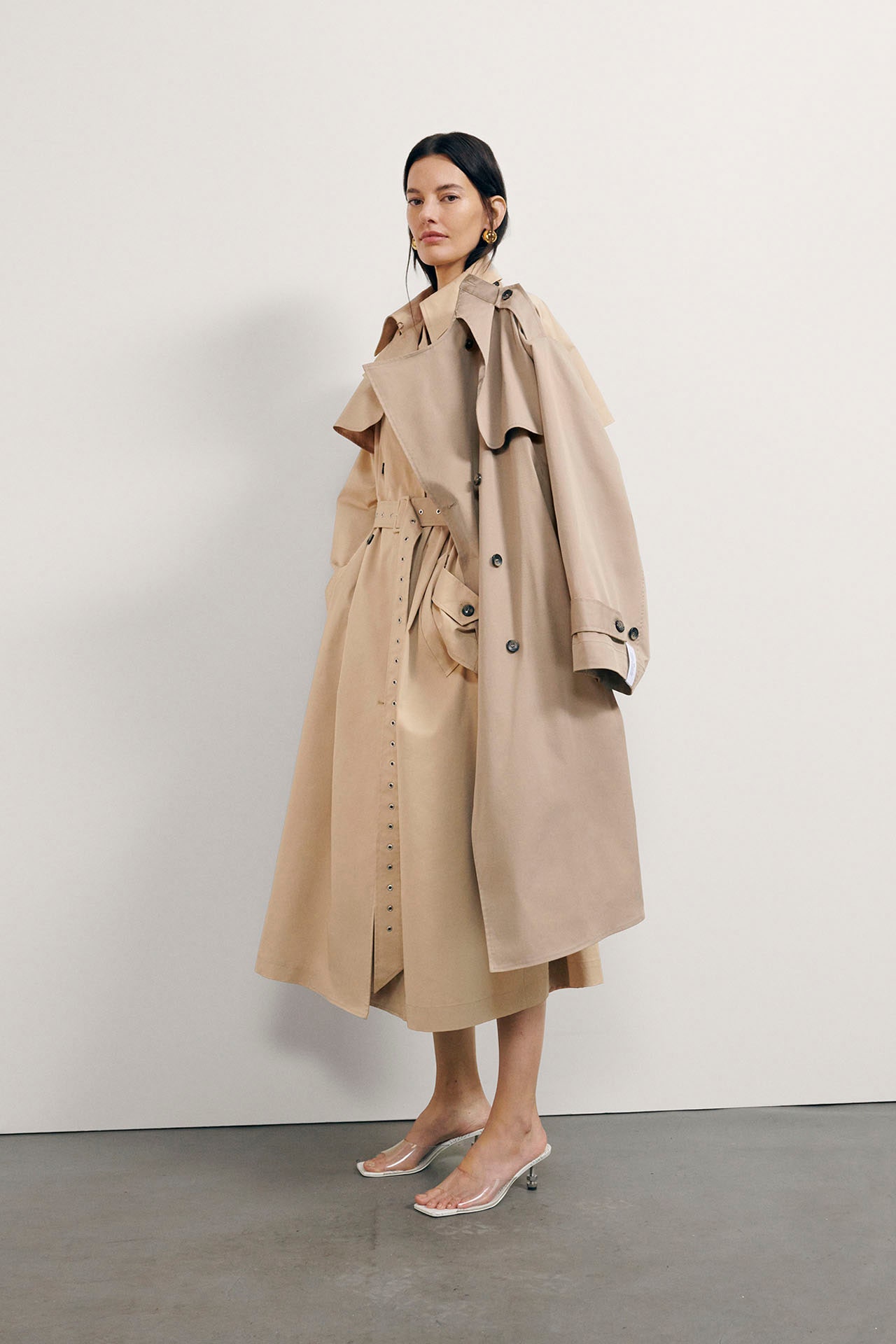 Image may contain Clothing Coat Overcoat Trench Coat Footwear High Heel and Shoe